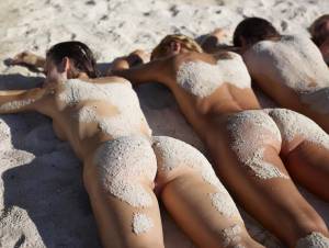 Four naked girls laying on the sand-j7murkqr3x.jpg