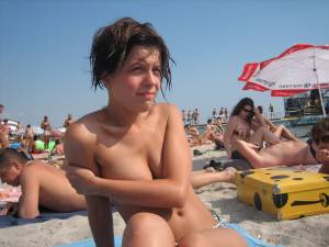 Sexy brunette tanning on the beach-l7n0m9jvho.jpg
