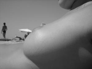 Sexy-brunette-tanning-on-the-beach-i7n0m93gns.jpg