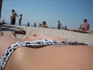 Sexy brunette tanning on the beacha7n0m96hs0.jpg