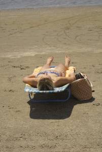 Blonde with tiny bikini sunbathes - voyeur spying-l7n42l31sq.jpg