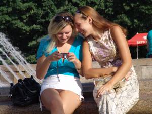 Beautiful blonde and her friend sit by a fountain!77nwjfr3un.jpg
