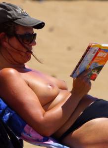 MILF on the Beach showing her tits-j7qabn4cok.jpg